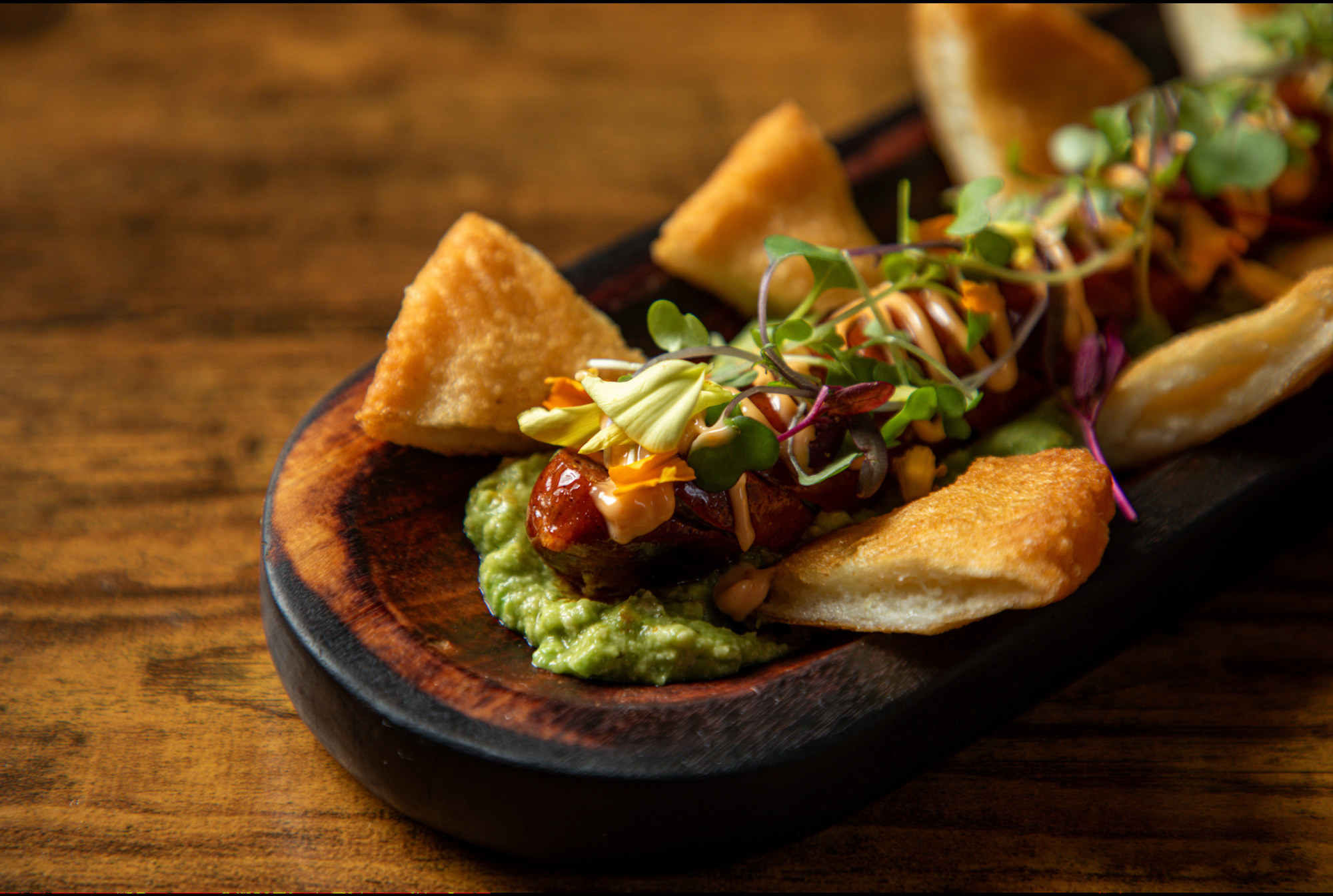 Chef Julio Machado culinary creation, plated with fresh ingredients and edible garnishes